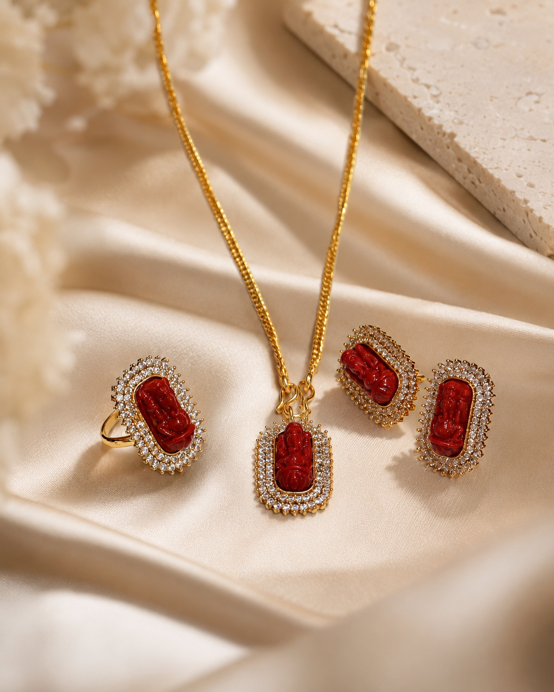 Gold-Plated Ganesh Jewelry Set with Red Stone Pendant and White Crystal Accents